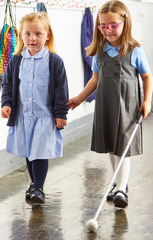 nell-at-school-with-her-cane-and-her-friend.jpg